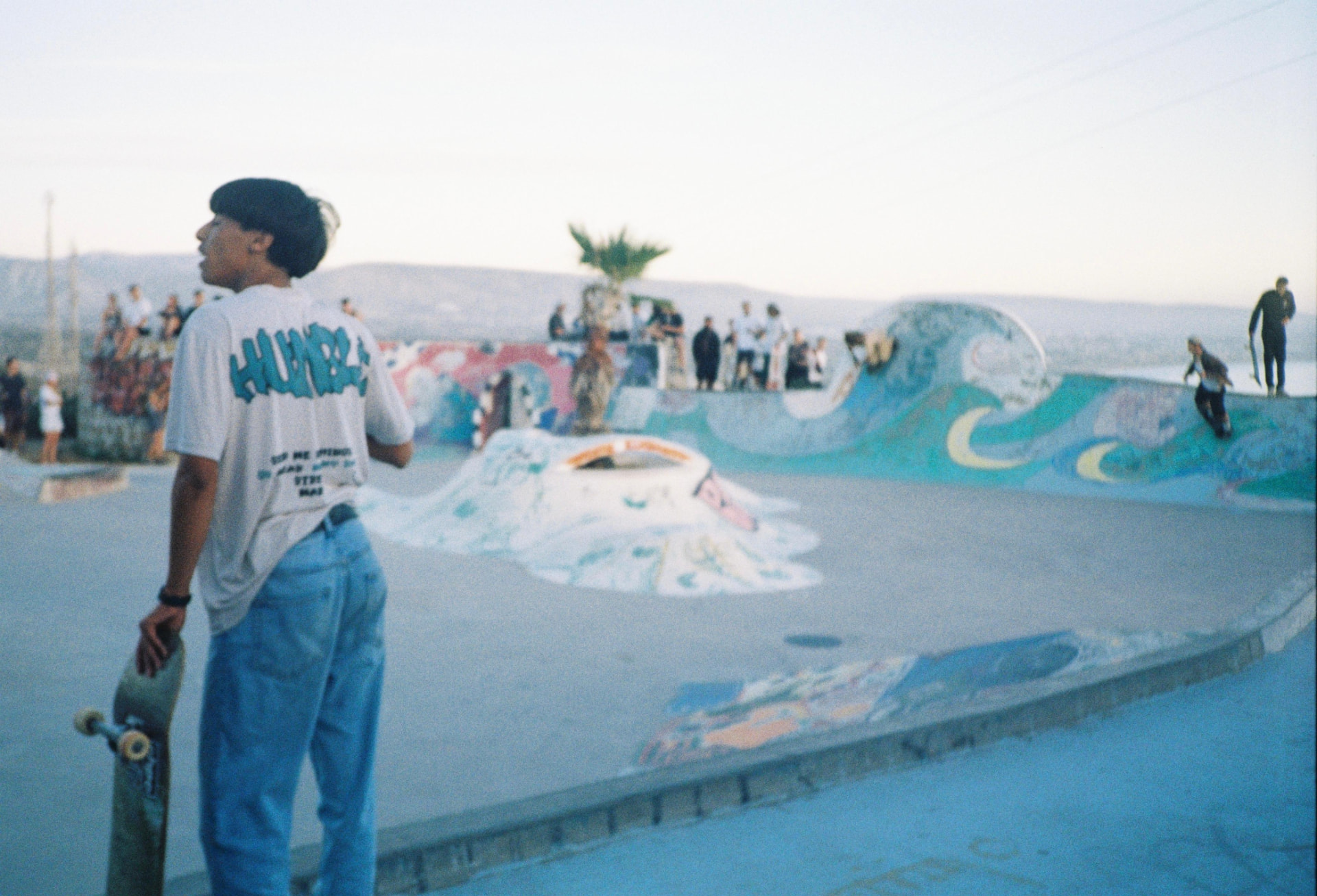 Skater overlooking the Taghazout skatepark at dusk